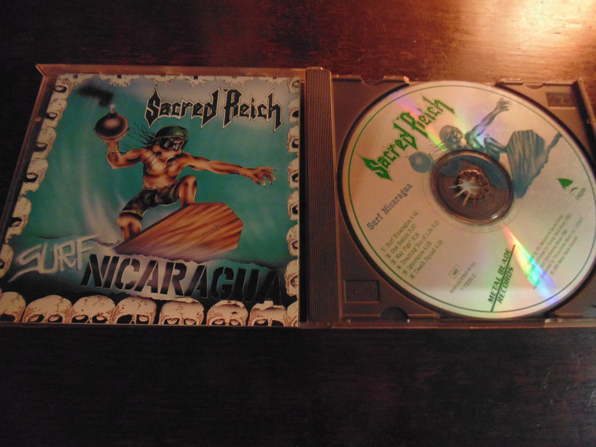 Sacred Reich CD, Surf Nicaragua, Original 1988 Metal Blade / Enigma, Green 7 73359-2